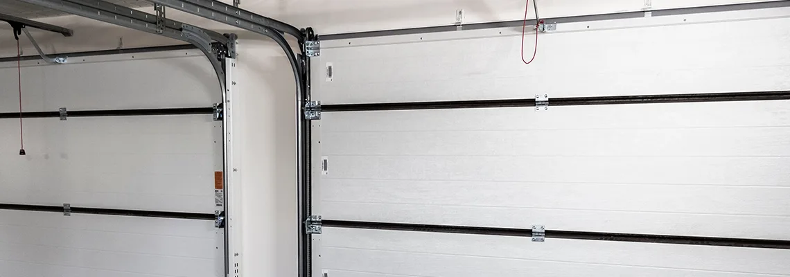 Fix Folding Garage Door Jerking in Calgary, Alberta